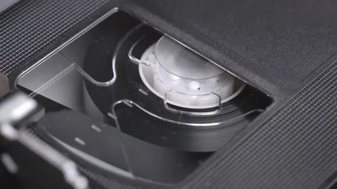 VHS video cassette inserting in the VCR, play, stop, eject, close up shot Stock Footage 155711875
