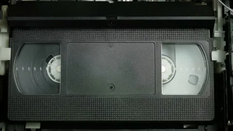 VHS video cassette is played in the VCR | Stock Video | Pond5