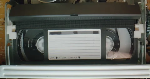 VHS video cassette recorder inside with blank tag. VHS mechanics video cassette Stock Footage 247016667