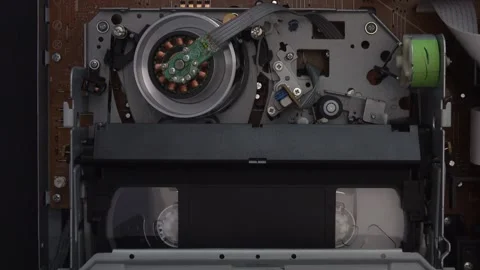 VHS Video Tape Loaded, Playing, and Ejected From a VCR Unit Video stock 314146860