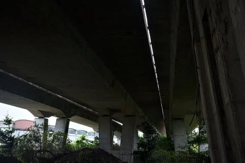 Viaduct on a cloudy sky seen from below Stock Photos