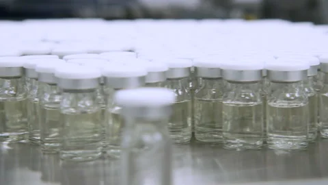 Vials on assembly- closeup Stock Footage 161259612