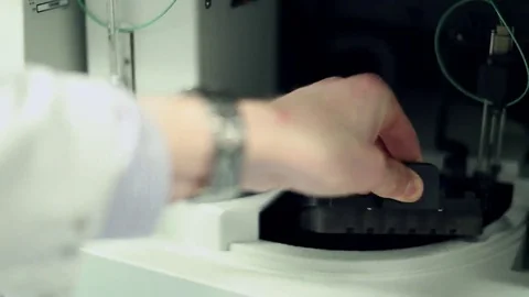 Vials Being Placed into a AS-AP Autosampler Chamber Stock Footage 69088069
