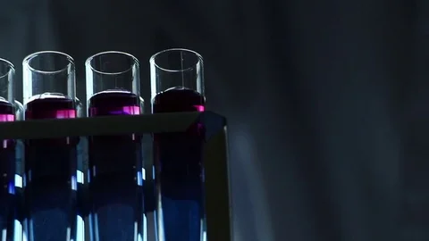Vials filled with chemicals on the dark background Stock-Footage 77209173