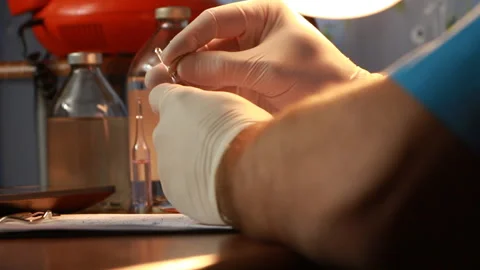 Vials with a solution the doctor cut and put on the table Stock Footage 86159745