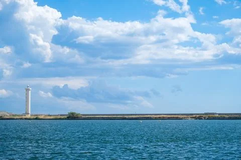Viareggio Diga Foranea Lighthouse with dramatic cloudscape above. Stock-Fotos