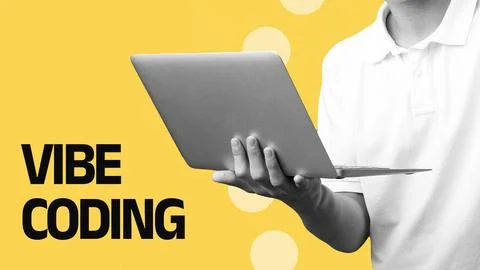 Vibe coding activity with laptop on a bright yellow background during a coding 스톡 사진