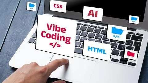 Vibe coding displays various programming elements near a laptop keyboard Stock Photos