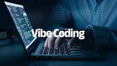 Vibe coding shows a person using a laptop to create computer programs during Stock Photos