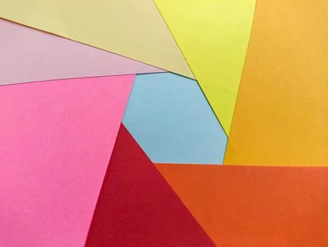 A vibrant abstract background with intersecting pink, yellow, orange, and b.. Stock Photos