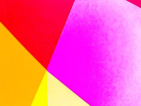A vibrant abstract background with intersecting yellow, pink, and red paper.. Stock Photos