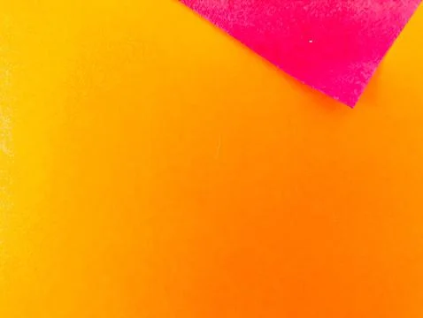 A vibrant abstract background with intersecting yellow and pink paper. Perf.. Stock Photos