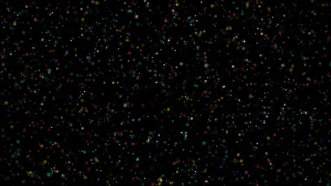 A vibrant abstract background of scattered colorful bokeh particles creates a Stock Footage 344240694