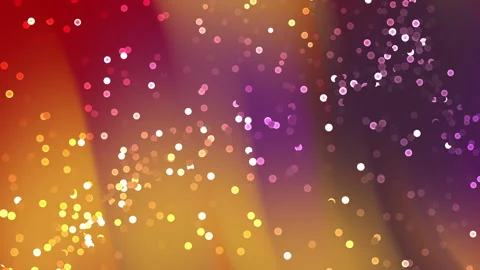 Vibrant abstract background with sparkling gold and purple particles for ce.. 스톡 동영상 330828636