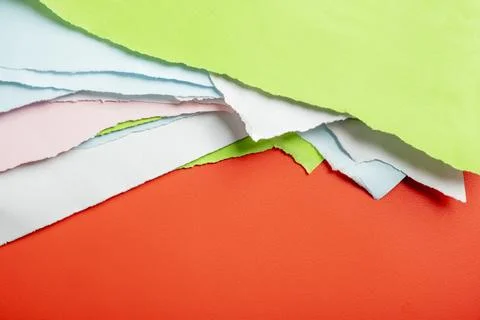 Vibrant abstract composition made of layered torn sheets of colored paper i.. Stock Photos
