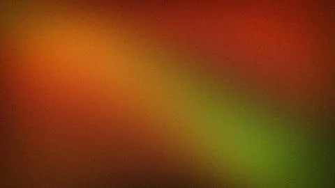 Vibrant abstract grainy gradient background with warm orange red and green .. Stock Photos