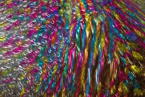 Vibrant abstract holographic texture featuring metallic dots and a rainbow .. Stock Illustration