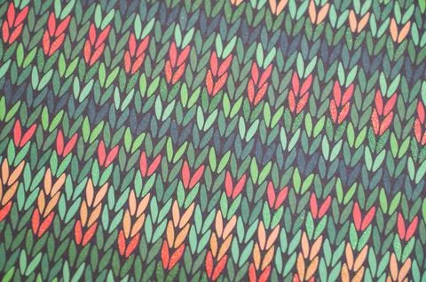 Vibrant abstract leaf pattern with green and red motif on dark background Stock Photos