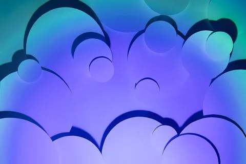 Vibrant abstract pattern of different circles fly with radial gradient of vio Foto stock