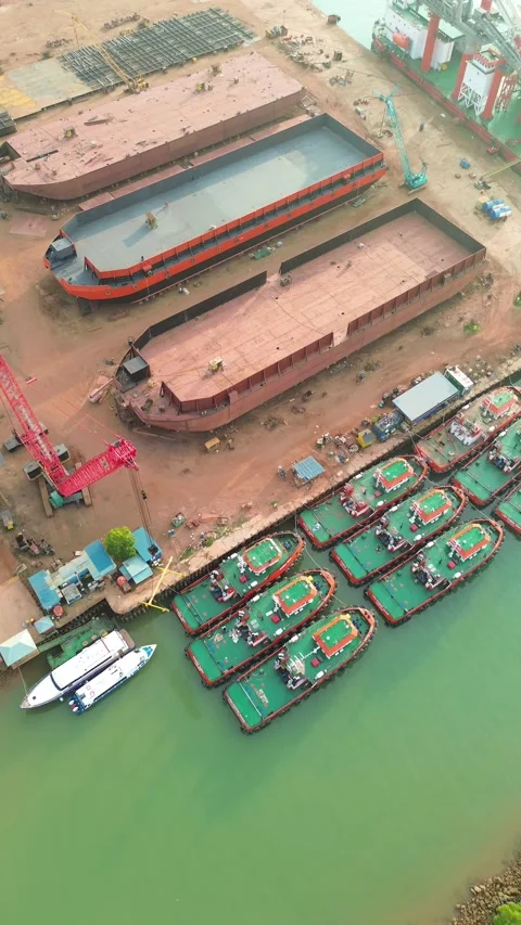 Vibrant aerial display of active shipbuilding operations and a thriving ind.. Video stock 337281823