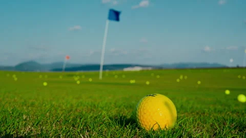 A vibrant and colorful golf training scene featuring a bright yellow ball Stock Footage 304827558