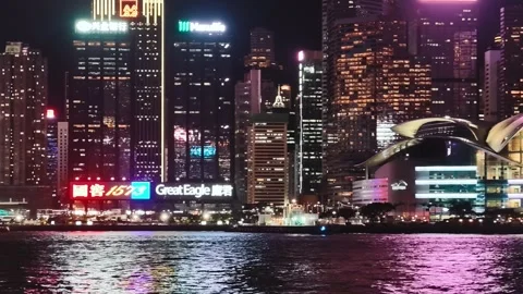 A vibrant and dynamic night scene of Hong Kong's iconic skyline centered on the Video stock 338280366