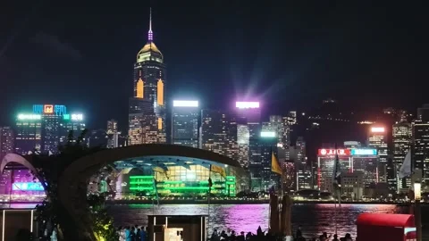 A vibrant and dynamic night scene of the Hong Kong skyline centered on the Video stock 338280391