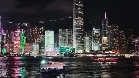 A vibrant and dynamic night scene of Hong Kong's iconic skyline centered on the Video stock 338280465