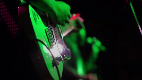 A Vibrant and Engaging Guitar Performance Beneath Bright Stage Lights That Video stock 291018961
