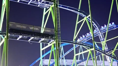 A Vibrant and Exciting Nighttime Roller Coaster Structure Located in the Stock Footage 318616287