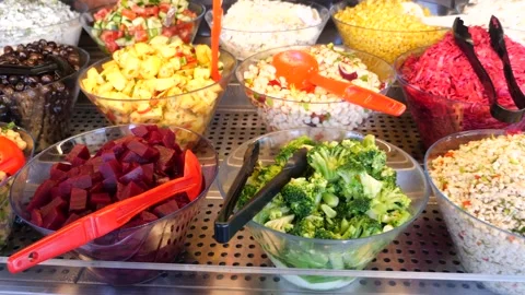 A vibrant and inviting salad bar displaying an array of fresh, colorful, an.. Stock-Footage 332744756
