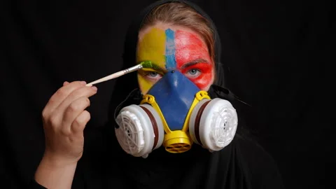Vibrant and Striking Expression Captured in a Unique Gas Mask Artistic Face Stock Footage 315415365
