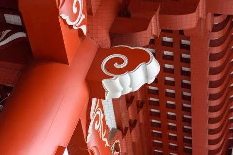 A vibrant architectural structure with intricate red and white decorative e.. Stock Photos