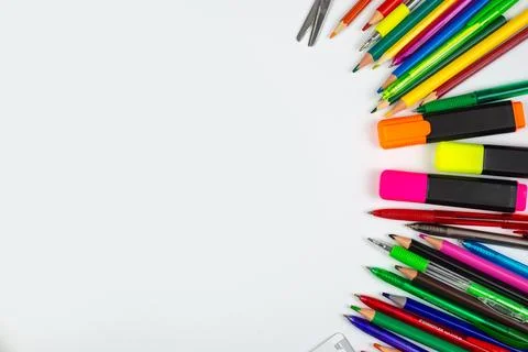 A vibrant array of colorful art supplies beautifully displayed on a clean w.. Stock Photos