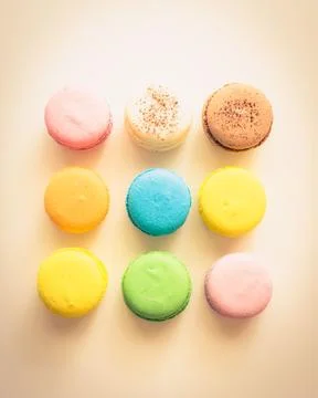 Vibrant array of colorful macarons on a table Stock Photos