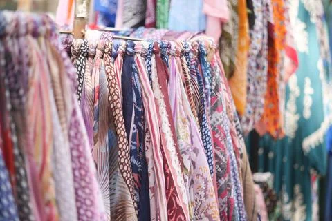 A Vibrant Array of Colorful Scarves Displayed at a Local Market Stall 스톡 사진