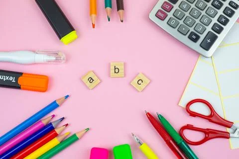 A vibrant array of colorful school supplies and playful ABC letters set aga.. Stock Photos