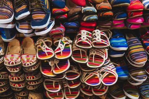 Vibrant Array of Handmade Footwear in a Store Stock Photos