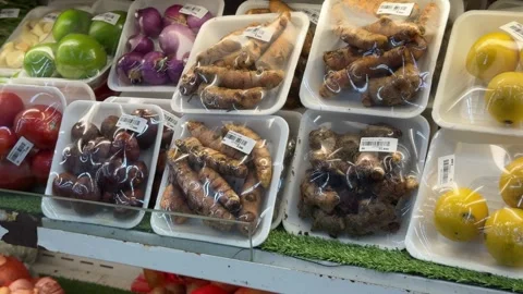 A vibrant assortment of pre-packaged fresh produce neatly displayed on a re.. Stock-Footage 326031503