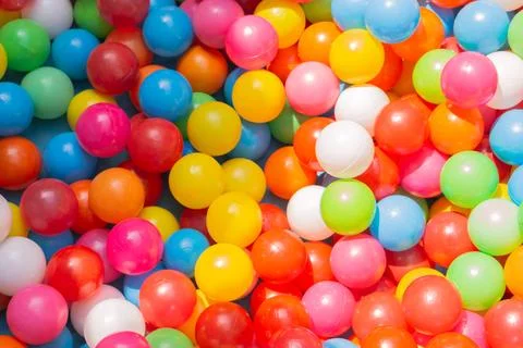 A vibrant background array of balloons illuminates the image with a Foto stock