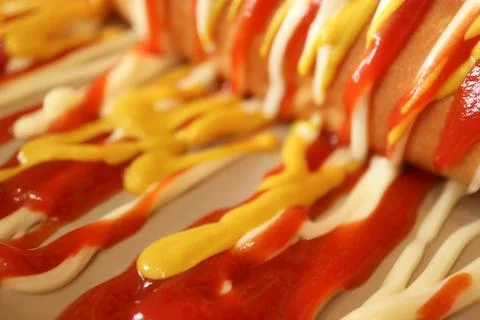 Vibrant background texture of delicious fast food sauces drizzled together Stock Photos