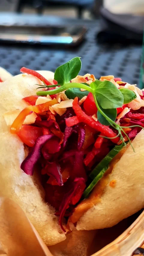 Vibrant Bao Buns Filled with Fresh Vegetables and Herbs Vídeos de archivo 336468284
