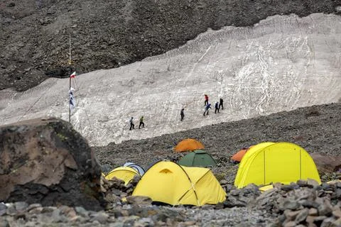 Vibrant Base Camp: A community of explorers prepares for their ascent, thei.. Stock Photos