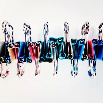 Vibrant Binder Clips in a Row Stock Photos