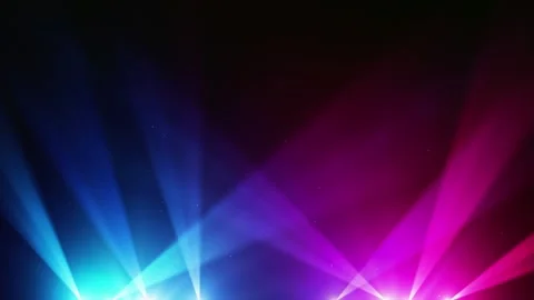 Vibrant blue and pink stage spotlight beams shining through atmospheric haze in Видео 344714666