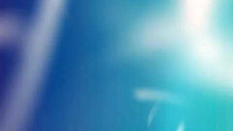 Vibrant blue background with white light effects イラスト素材
