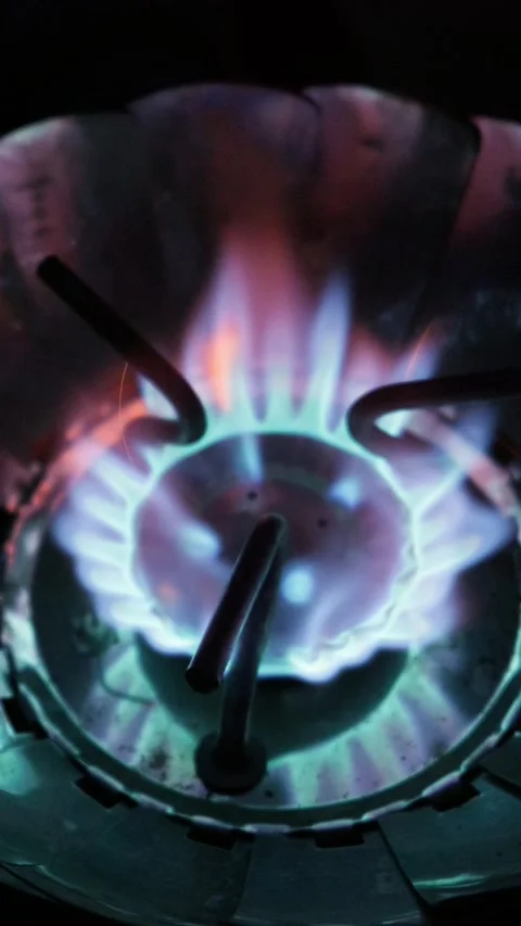 Vibrant Blue Gas Flame Burning on Portable Camp Stove in Darkness Stock Footage 341997007