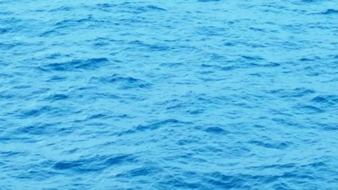 Vibrant Blue Ocean Water Surface with Gentle Ripples Texture Stock Footage 344830109
