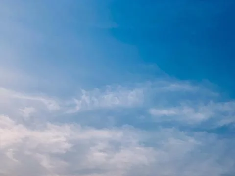 Vibrant Blue Sky Gradient With Soft White Clouds Daytime Jakarta Indonesia 库存照片
