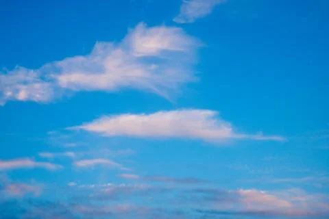 Vibrant blue sky with light clouds Stock Photos